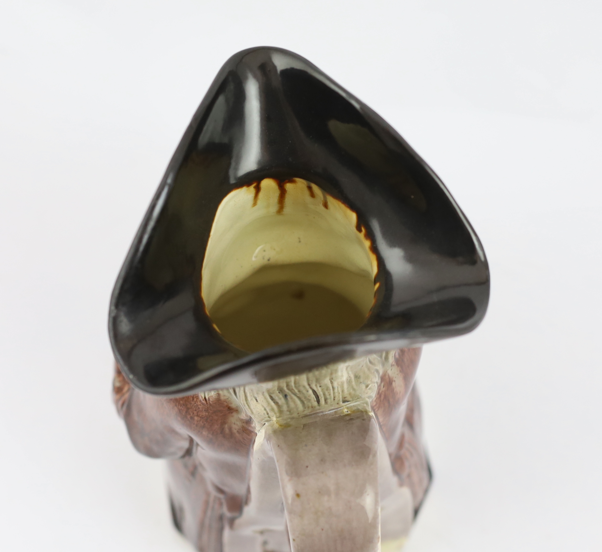 A Ralph Wood type creamware Toby jug of standard type, c.1790, glaze losses and some retouching to the enamels